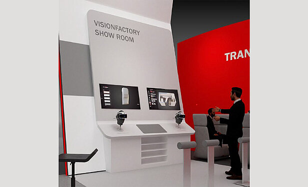 Vision Factory Showroom mit 3D-Konfigurator, Bildschirme mit Darstellungen und Bedienpult im Vordergrund.